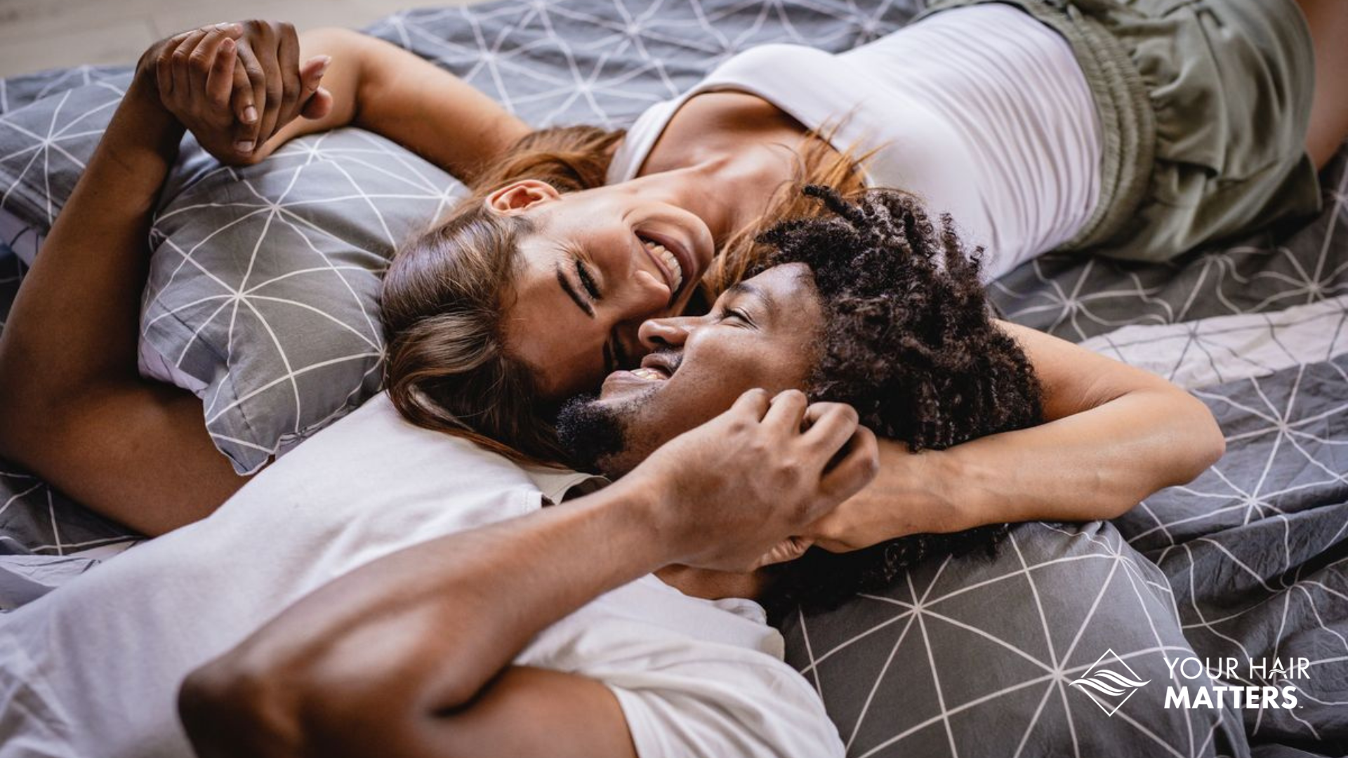 Man wearing a hair system snuggling with a woman. hair loss, intimacy, 